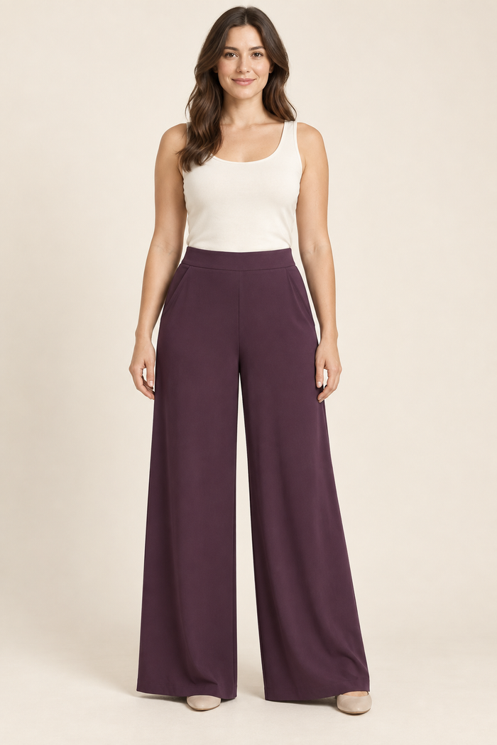 AI preview: aubergine woven palazzo pants with a smooth flat front waistband, slanted hip pockets and wide unpleated legs.