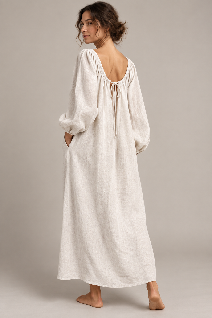 AI design concept: back view of a long linen smock dress with a low gathered neckline, ties and full sleeves.