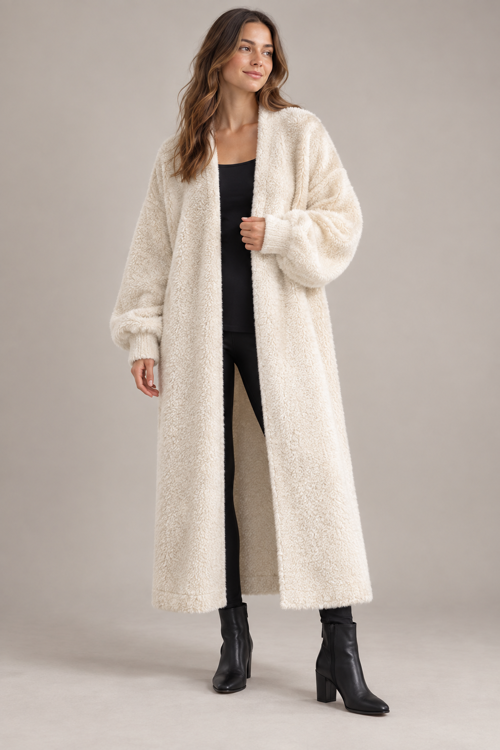AI design concept: cream long open-front blanket cardigan with dropped shoulders and cuffed sleeves.