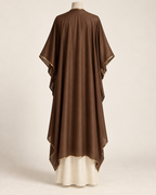 AI concept illustration of 1919 draped evening wrap, back view in brown, on a mannequin.