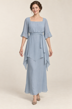 AI design concept: mist-blue square-neck party dress with pointed overlay, front.