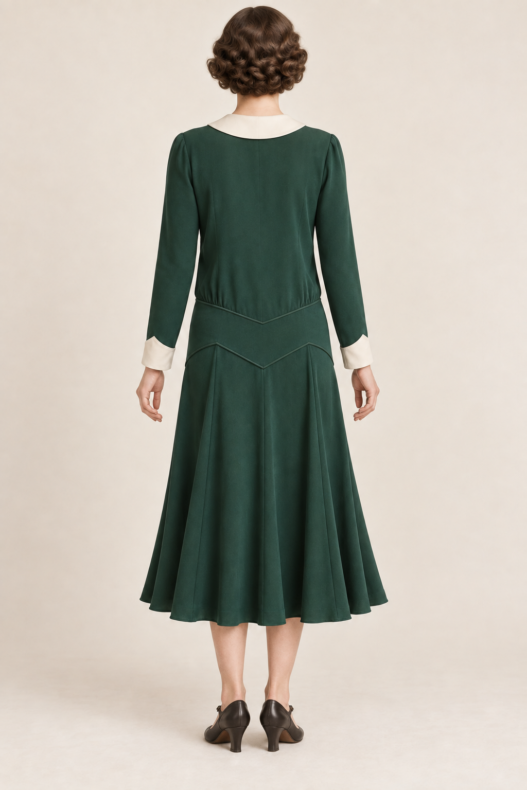 AI design concept: emerald chevron-yoke dress showing the pointed back yoke and long cuffed sleeves.