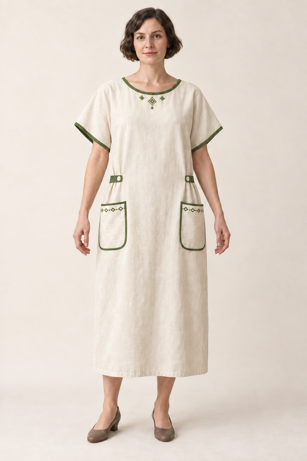 AI design illustration of the same cream bungalow apron dress with leaf-green edging and side tabs, front view