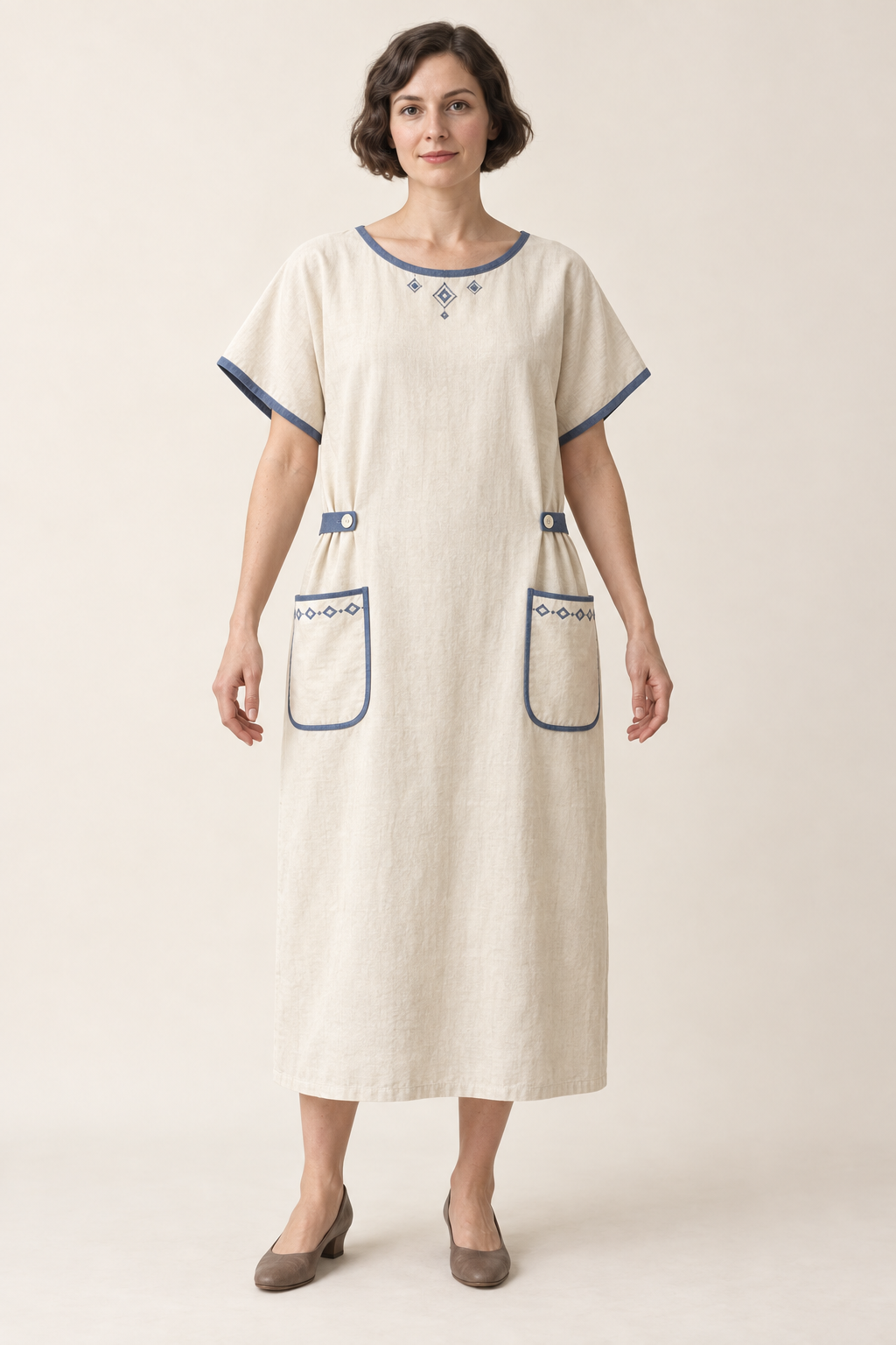 AI design illustration of a cream 1923 bungalow apron dress with indigo edging, kimono sleeves, buttoned side tabs and rounded pockets, front view