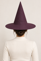 AI design preview: same aubergine witch hat and adult woman from behind, showing plain crown and brim joining seams