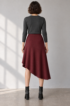 Rear design preview of the same oxblood midi skirt, with a smooth faced waist and closed mid-calf back