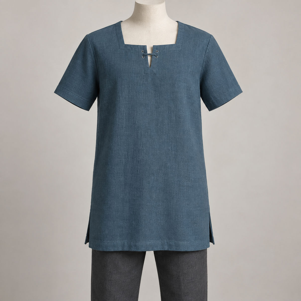 AI design preview: petrol-blue menswear tunic with square faced neckline, short laced keyhole, short set-in sleeves and side hem vents