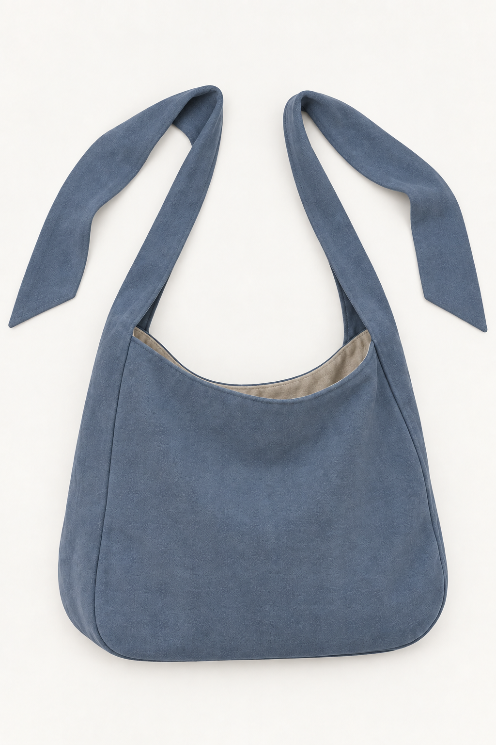 AI design preview: slate-blue shoulder bag untied to show two separate free strap ends and a curved open rim