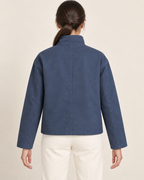 AI design preview: rear of the same blue boxy jacket showing its plain body and center-back seam without a yoke