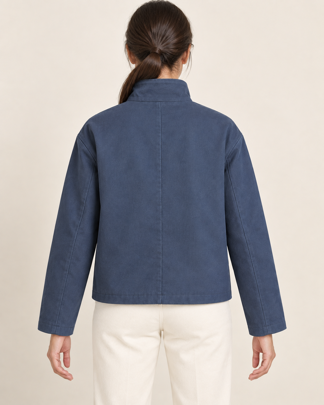 AI design preview: rear of the same blue boxy jacket showing its plain body and center-back seam without a yoke