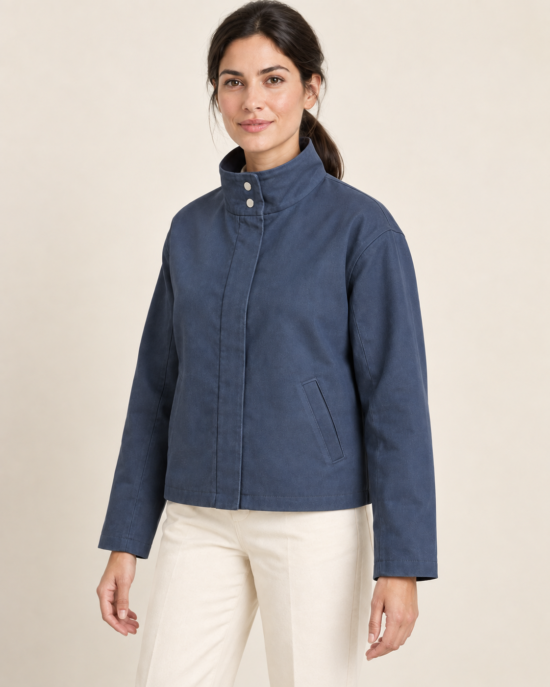 AI design preview: three-quarter view of the blue unlined jacket design showing tall collar, covered center opening and welt pocket