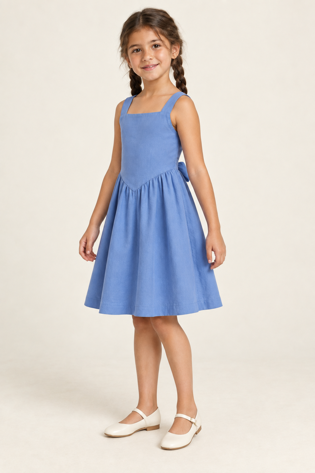AI design preview: three-quarter view of the blue child dress showing its V-shaped front waist seam and smooth plain bodice