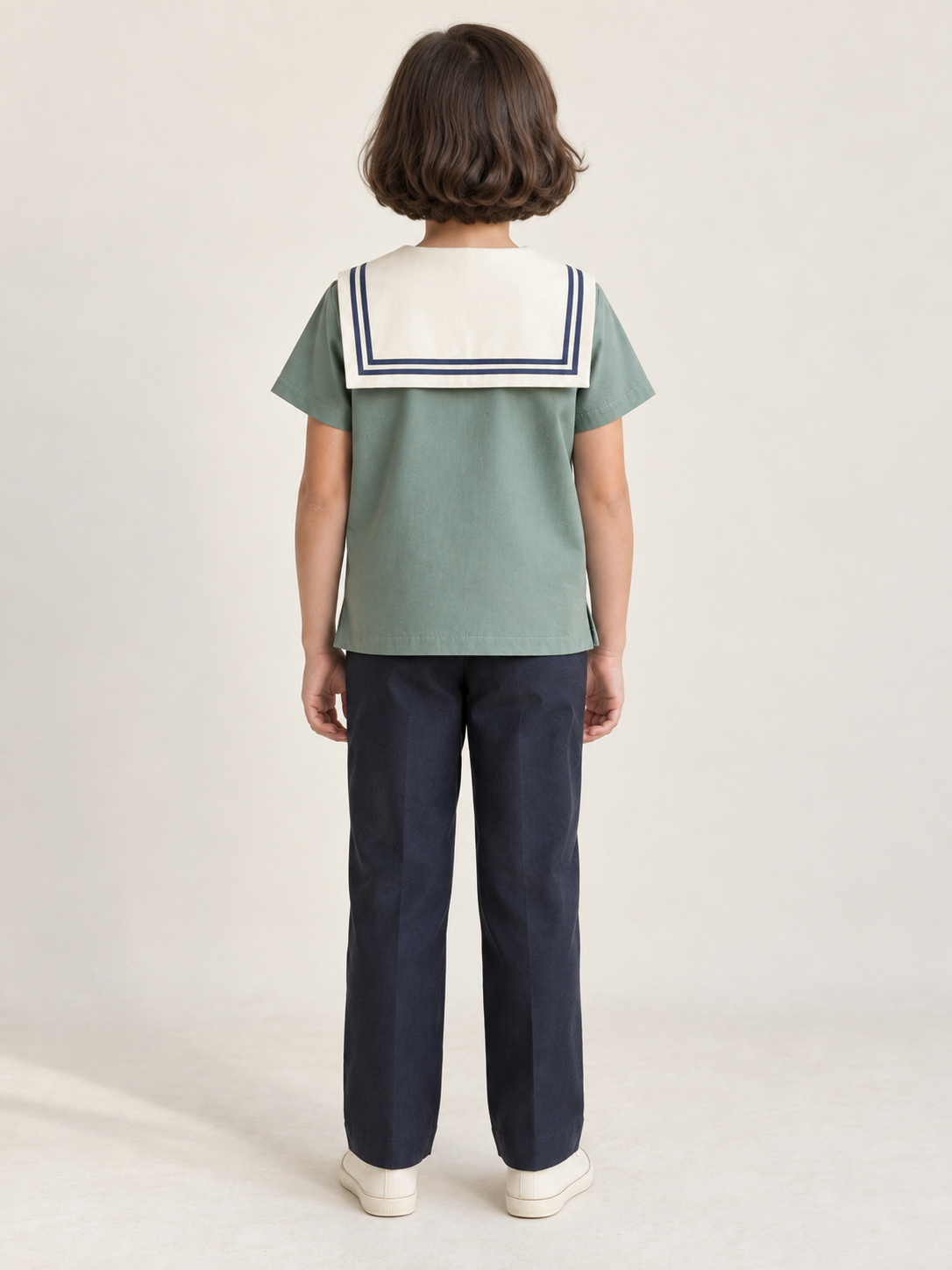 Rear view of children's sea-green middy blouse showing an ivory square sailor collar