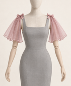 AI design preview: dusty-rose shoulder cape sleeves showing the same short open flounces and bows.