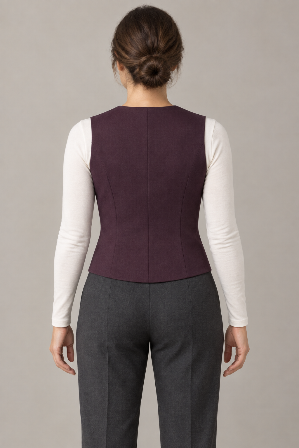 AI design preview: rear of the same plum waistcoat on an adult woman, with a closed shaped back, center seam and no belt