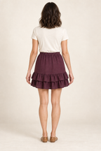 Rear design preview of the same plum mini skirt, with a level elastic waist and two continuous overlapping ruffles