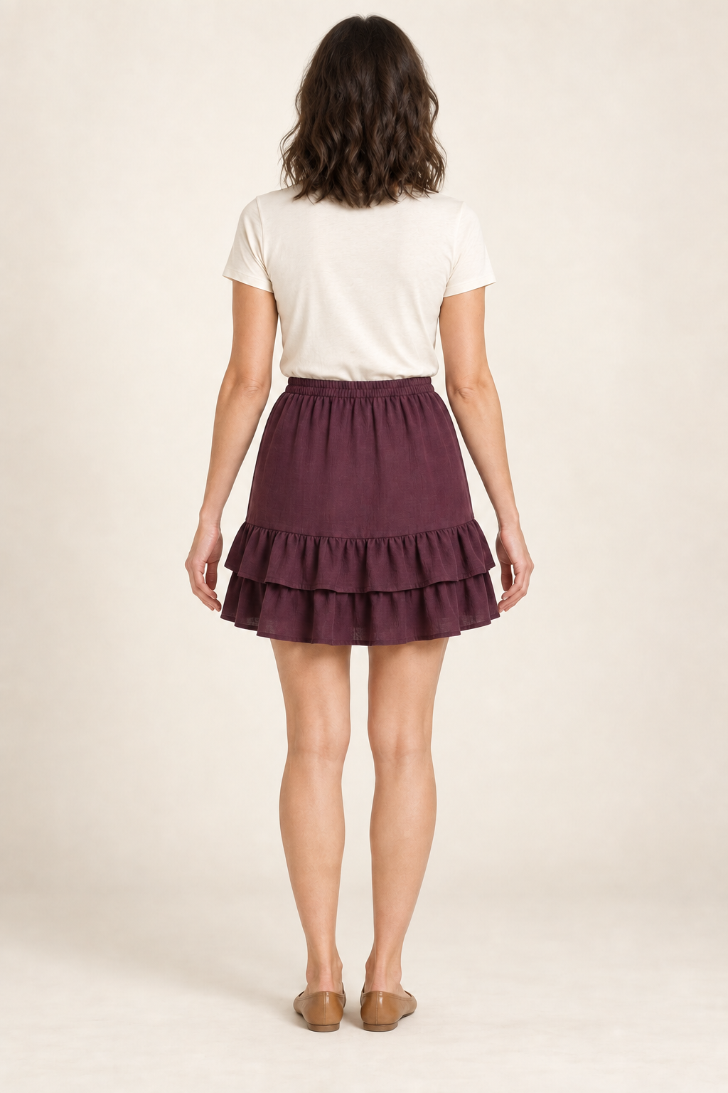 Rear design preview of the same plum mini skirt, with a level elastic waist and two continuous overlapping ruffles