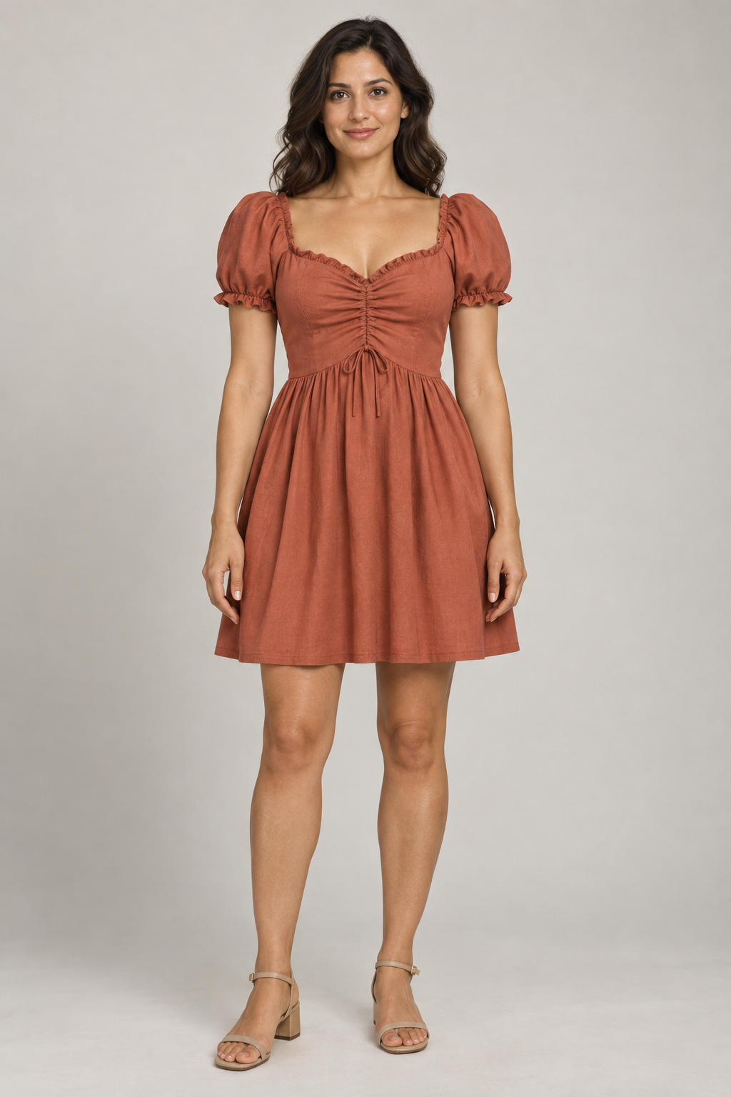 AI design preview: adult woman wearing terracotta sweetheart dress with center drawstring gathers, raised curved waist and short puff sleeves, front view