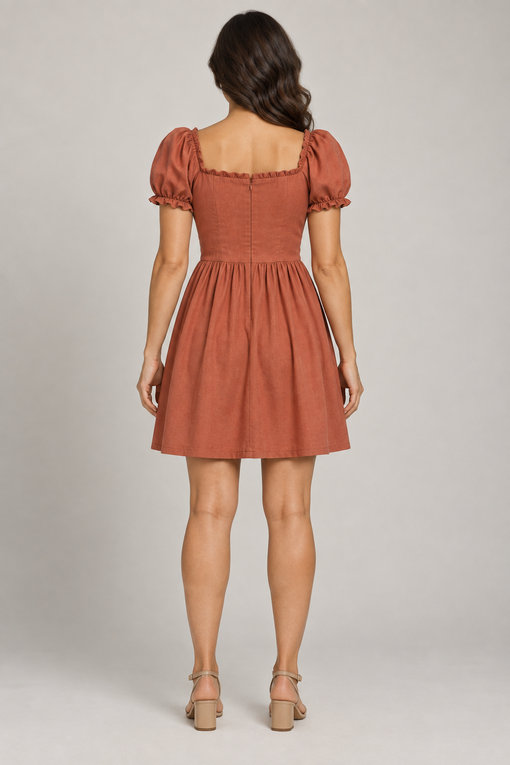 AI design preview: terracotta dress on the same adult woman with smooth square back, waist shaping and concealed center zipper, rear view