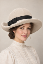 AI design illustration of the wide rolled-brim hat in ivory corduroy with a black band and flat bow