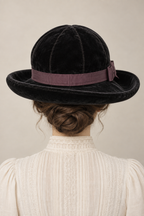 AI design illustration of the black rolled-brim hat from behind, showing crown seams and the continuous plum band