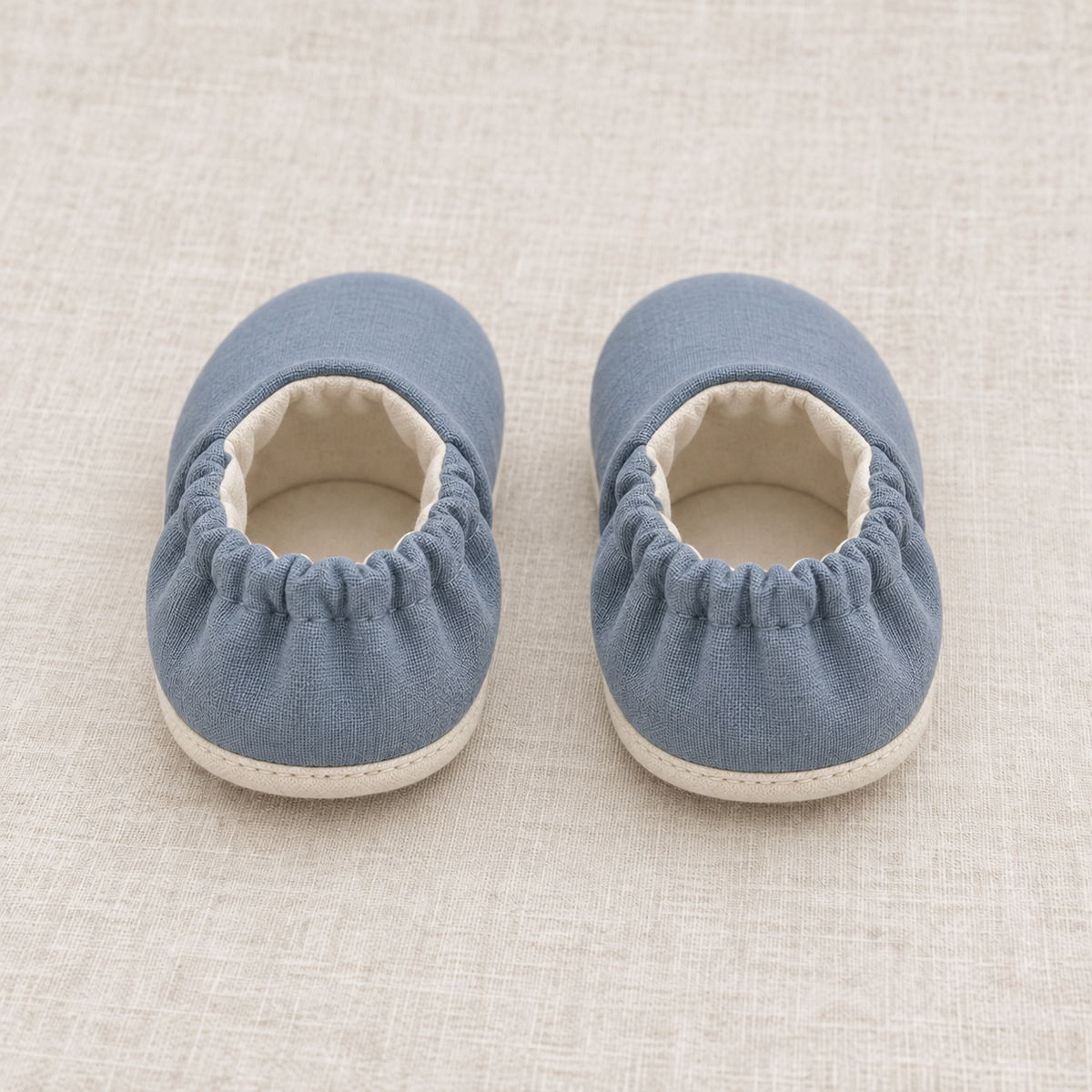 AI design preview: rear of the same baby shoes showing enclosed heel elastic and soft ankle openings