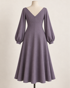 AI preview: V back of the smoky-violet gored dress with a concealed back zipper, empire seam and cuffed balloon sleeves.