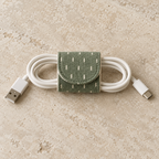 Design preview: sage cotton cord wrap with a rounded flap closed around the middle of a coiled ivory cable.