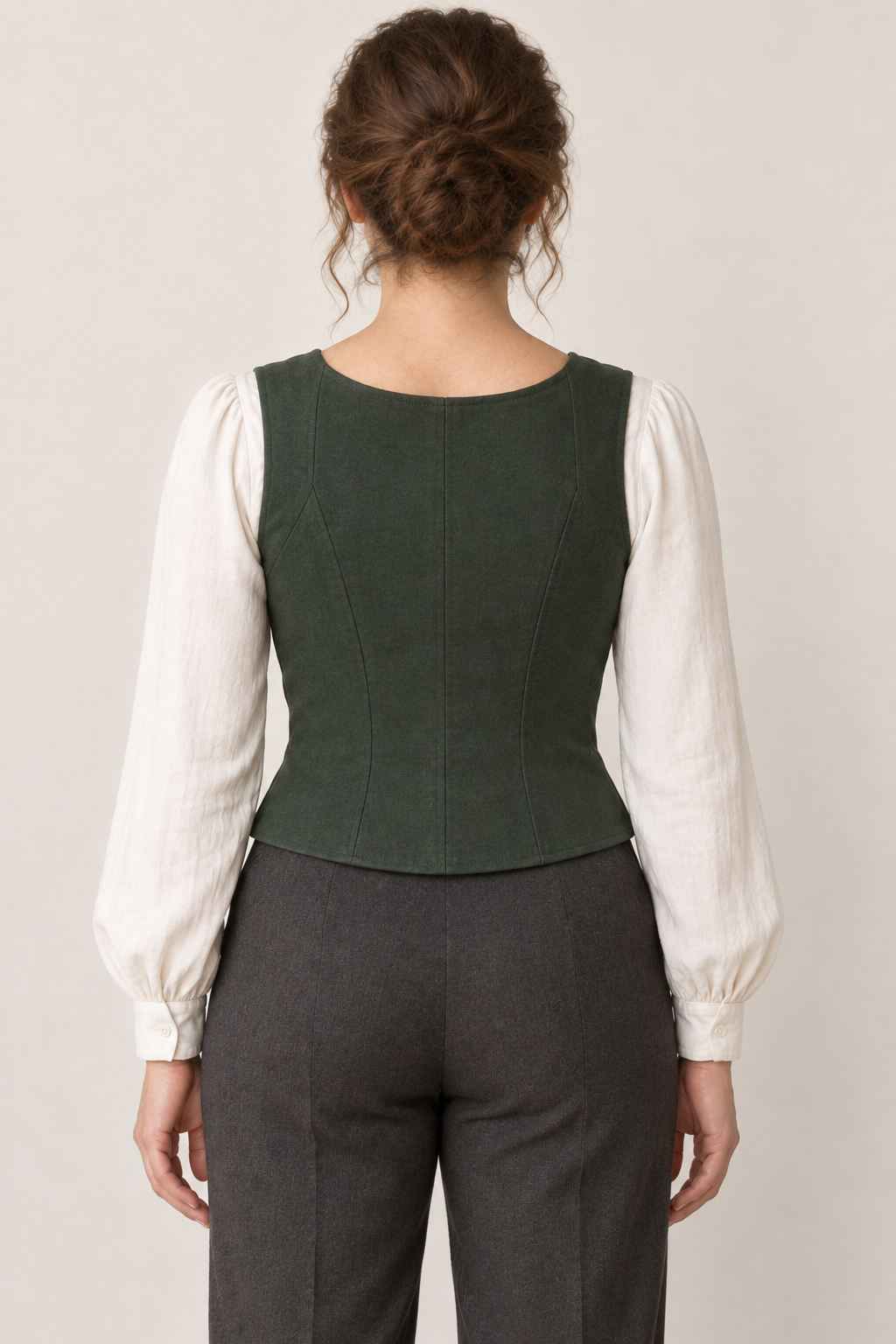 AI design preview: same forest-green vest from behind, showing closed shaped back, broad straps and plain waist-length hem