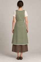 AI design preview: closed rear of sage pinafore apron with broad shoulders and smooth waist tie