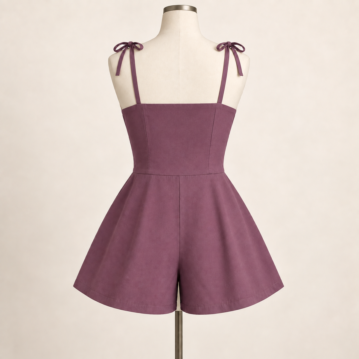 AI design preview: dusty-plum romper back with straight covered upper edge, vertical shaping, shoulder ties and smooth waist join