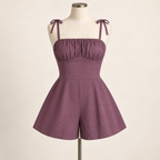 AI design preview: dusty-plum romper with gathered front bust, smooth fitted midriff, shoulder ties and two wide flared short legs