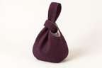 AI design preview: plum and flax color of the same Japanese knot bag with thread-through loop closure