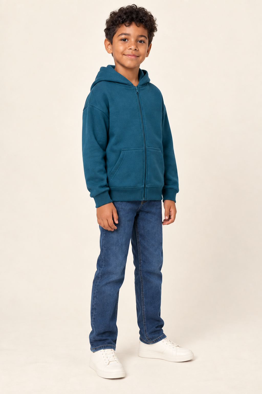 AI design preview: petrol-teal kids hoodie on the same child, showing full front zipper, split pockets and dropped shoulders in three-quarter view