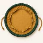 AI design preview: forest-green and ochre lay-flat dice pouch open with six inner pockets around a clear circular center.