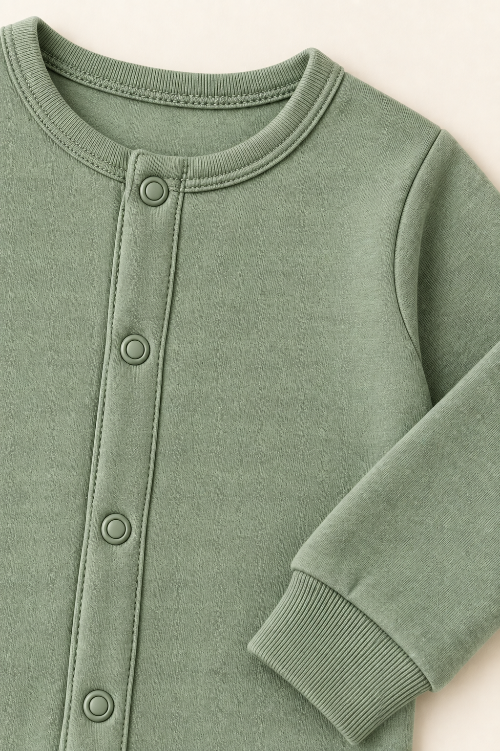 AI concept detail of the coverall rib neckline, tonal snap band and wrist cuff
