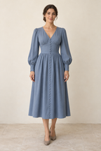 AI design preview: adult woman in a dusty-blue V-neck midi dress with a button-loop front, gathered bust and long bishop sleeves
