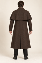 AI design preview: rear of ink-brown men's capelet duster with a curved shoulder layer and center-back walking slit