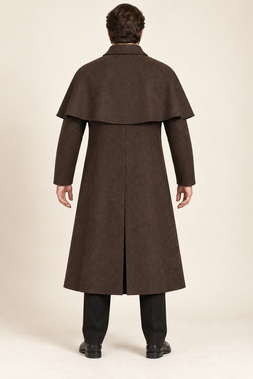 AI design preview: rear of ink-brown men's capelet duster with a curved shoulder layer and center-back walking slit