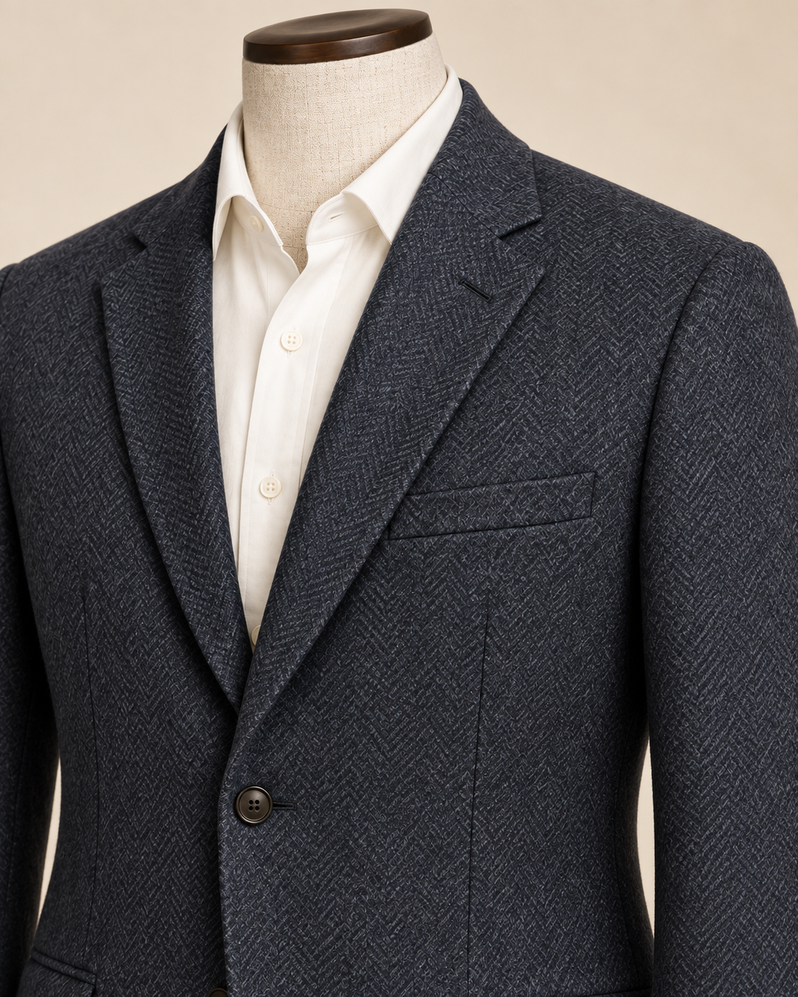 AI concept detail of men's sport coat notched lapel, herringbone texture and welt breast pocket.