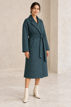 AI design preview: three-quarter view of the teal notched-collar quilted coat, showing diamond stitching and the belted overlap.