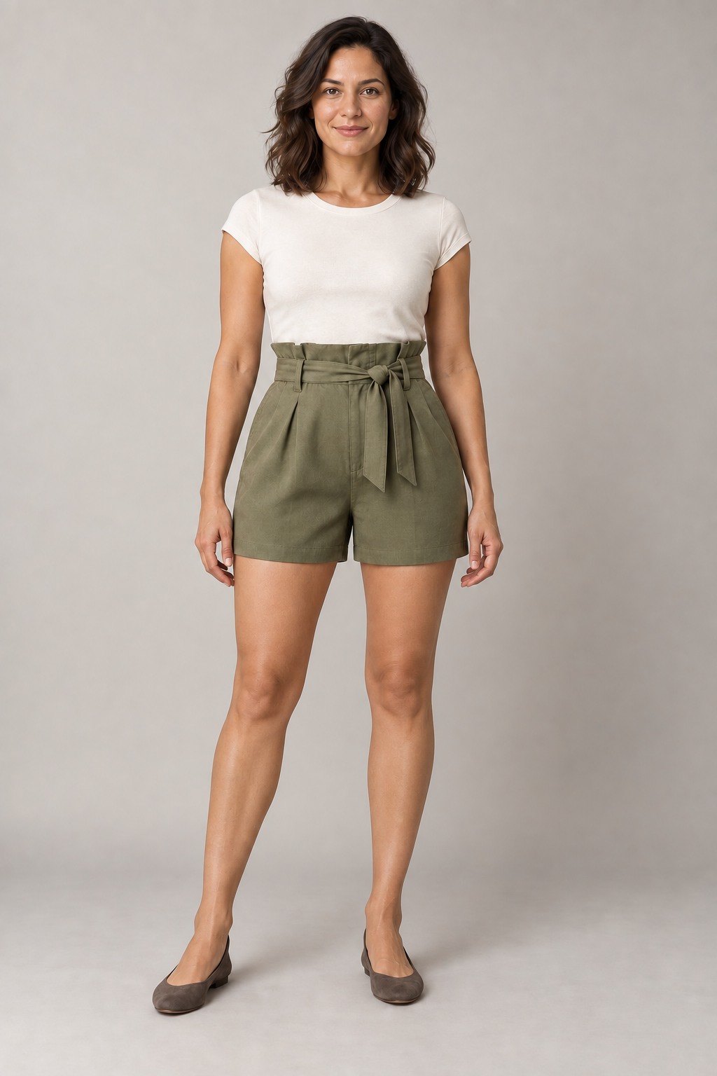 AI design preview: the same woman wearing olive paperbag shorts with the matching raised waist, sash, fly and slanted pockets