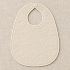 AI design preview: cream backing of the same rounded baby bib with bound neck opening and single snap, reverse view