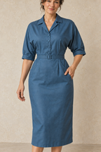 Closer front design preview of the peacock-blue dolman shirt dress collar, bodice opening, narrow belt and curved pocket joins.