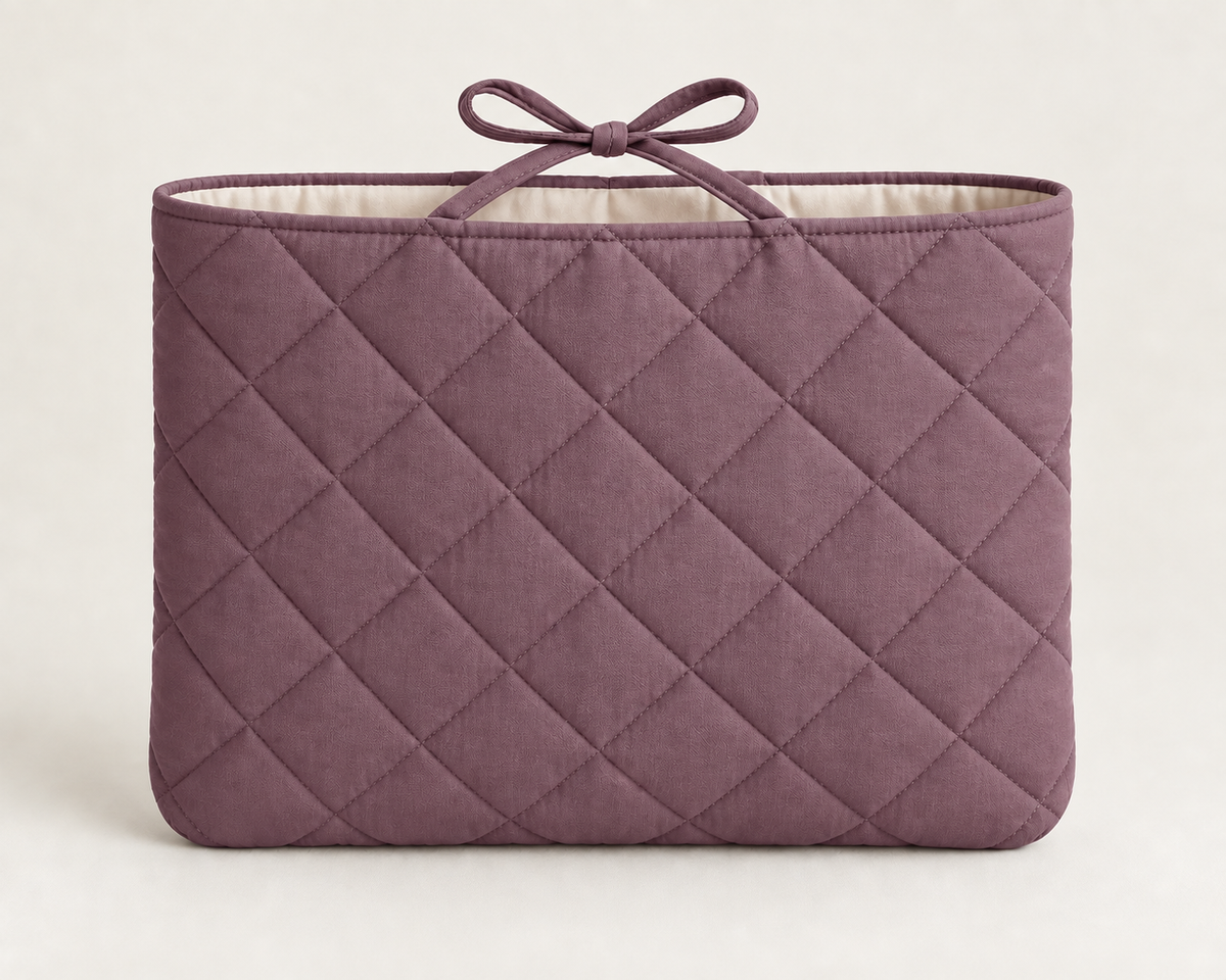 AI design preview: dusty-plum book sleeve showing the same diamond quilting and bow-tie opening