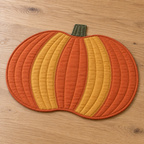 AI design preview: angled front of the same flat pumpkin placemat showing curved panels and low-loft quilted edge
