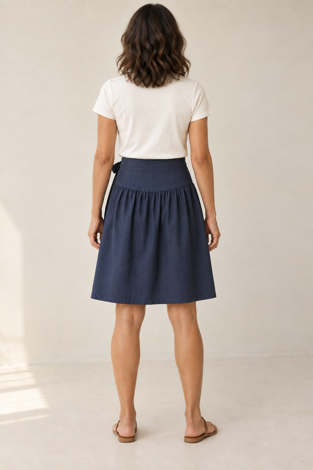 Rear design preview of the navy face of the reversible skirt, showing the smooth contoured yoke and one gathered lower section