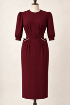 AI design preview: burgundy peg-top pocket dress with cream-bound raised pocket mouths and three-quarter sleeves.