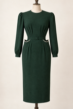 AI design preview: bottle-green peg-top pocket dress with raised cream-edged pocket mouths, waist pleats and long sleeves.