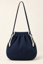 AI back preview of the same navy pouch bag with gathered mouth, plain back and single shoulder strap